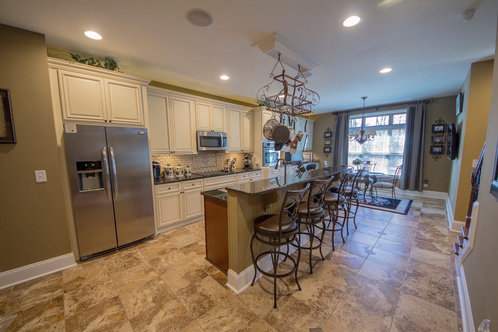 Custom kitchen design with island and open dining area