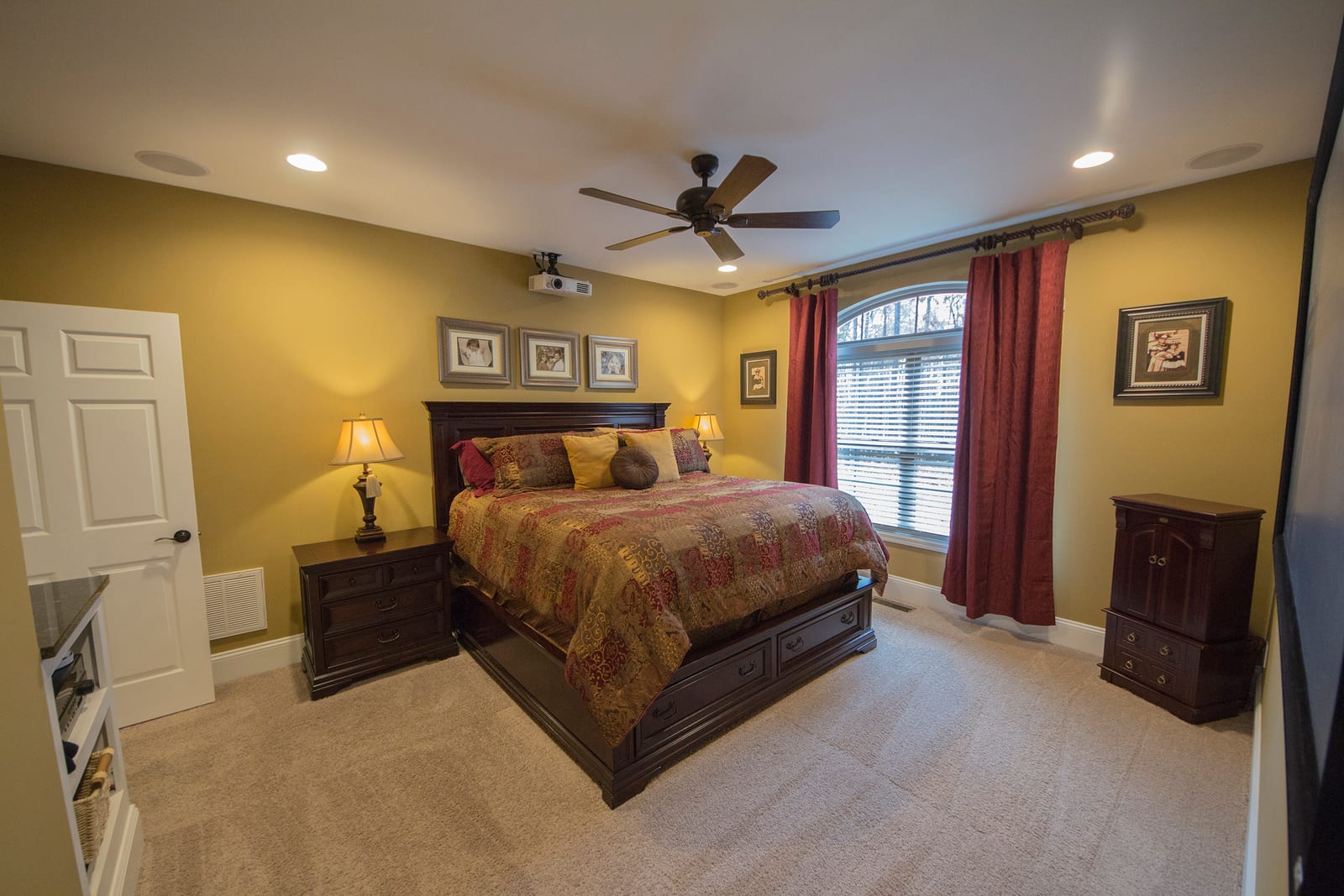 Primary bedroom design with built-in home theater features