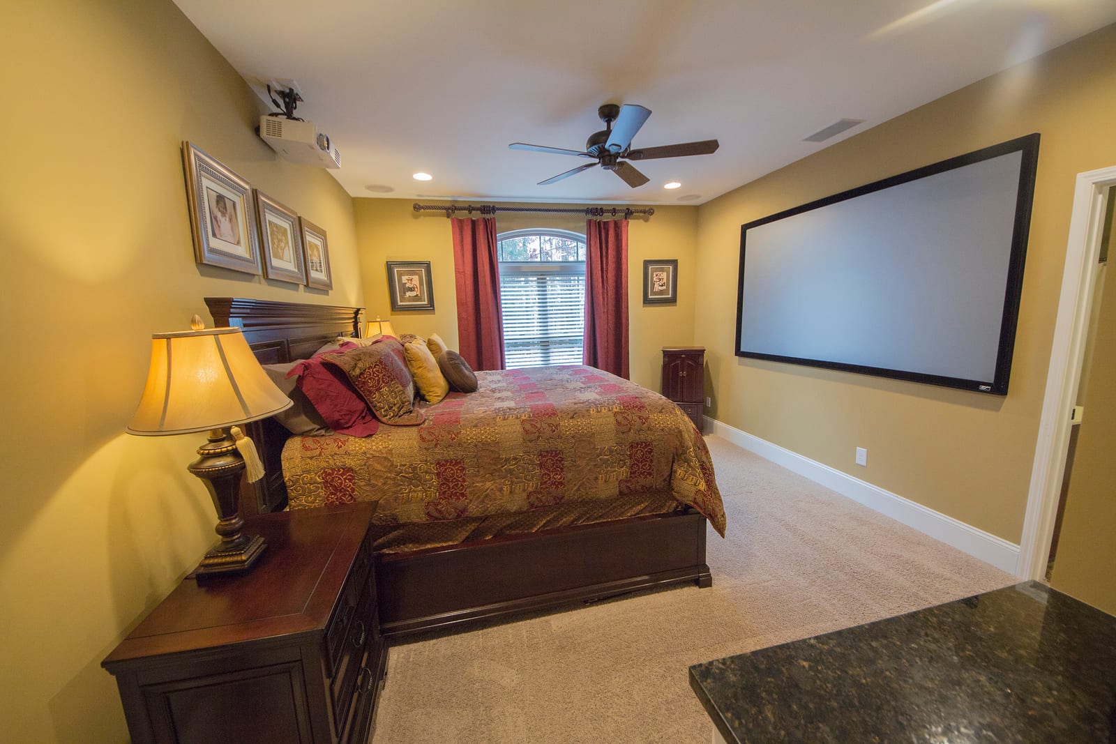 Primary bedroom design with large projection screen